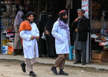 Two members of the Taliban's morality police on patrol in Afghanistan. (AFP)