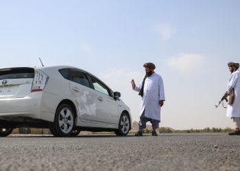 Taliban Morality Police enforce Sharia regulations on the streets of Afghanistan, stopping vehicles for inspections. (Photo Credit: Mohsen KARIMI / AFP)