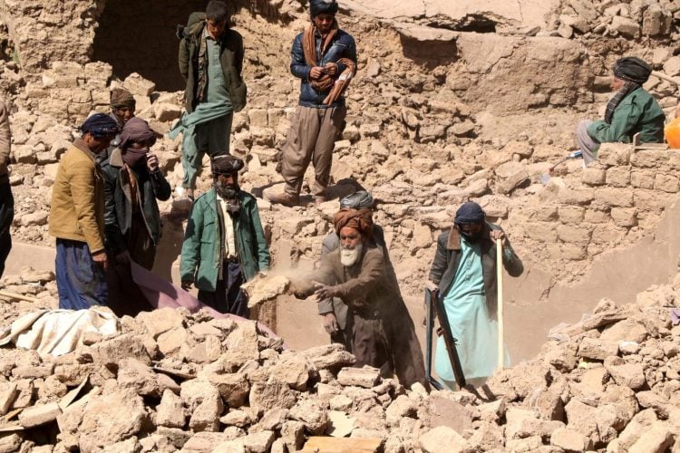 Local residents work tirelessly amidst the rubble in earthquake-stricken areas, as allegations of corruption and extortion in aid distribution surface. (Photo Credit: AFP)
