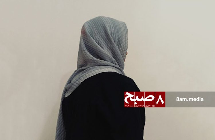 Nasrin stands solemnly with her back to the camera, symbolizing the silent anguish of Afghan refugees. (Photo Credit: 8am.media)