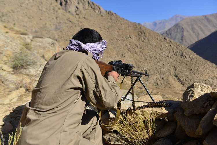 An anti-Taliban fighter takes aim in the rugged mountains of Afghanistan, highlighting the ongoing armed resistance against the group. (AHMAD SAHEL ARMAN/AFP)