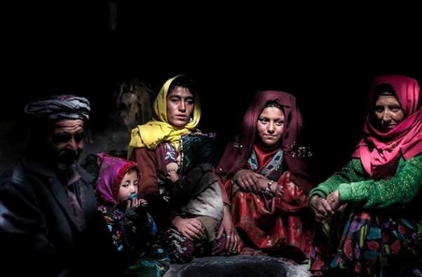 A man with two children and three women, reflecting the hardship of Kyrgyz people. (Photo Credit: Social Media)
