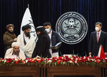Taliban ministers sign a mining contract with a Chinese company, solidifying their control over Afghanistan's natural resources. (Photo Credit: SAHEL ARMAN / AFP)