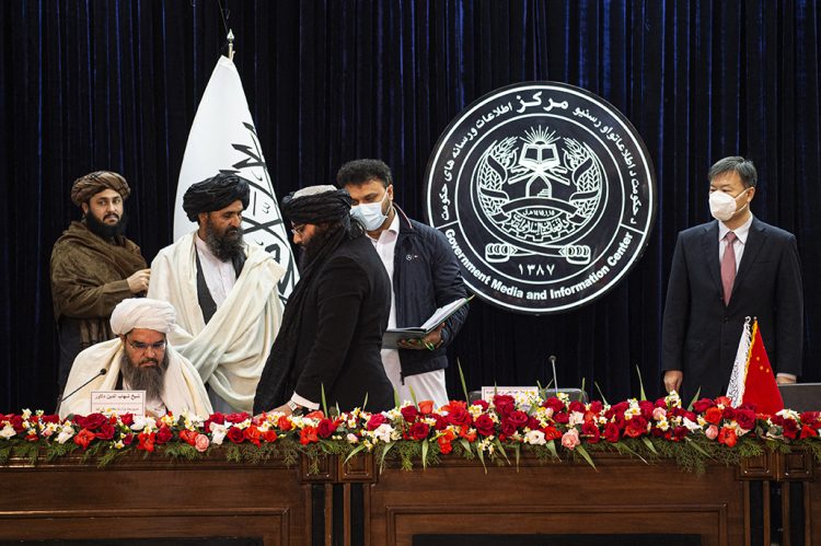 Taliban ministers sign a mining contract with a Chinese company, solidifying their control over Afghanistan's natural resources. (Photo Credit: SAHEL ARMAN / AFP)