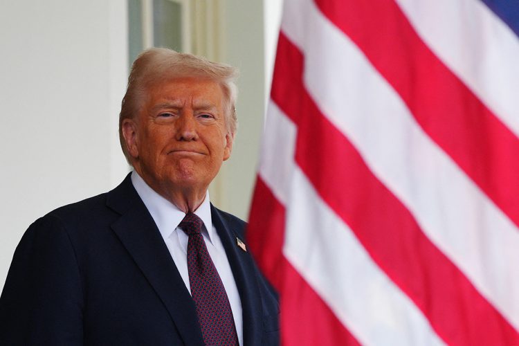 U.S. President Donald Trump at the White House, with the American flag in the background. (Photo Credit: AFP)