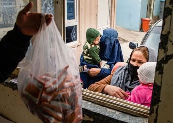 Mothers in Kabul wait to receive therapeutic food for their malnourished children at a WFP-supported nutrition center. (Photo Credit: WFP/Masoud Hussaini)