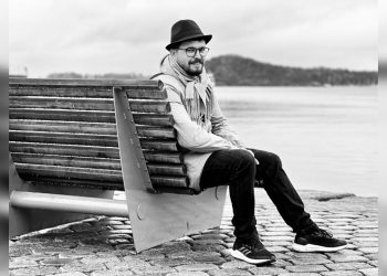 Curator Yama Rahimi pauses by the waterfront. (Photo Credit: Exclusive)