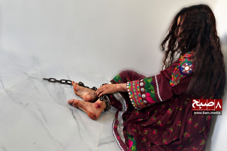 A woman in Afghanistan, chained and oppressed, symbolizes the escalating domestic violence and lack of legal recourse under Taliban rule. (Photo Credit: 8am.media)