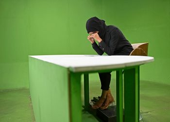 A female journalist in Afghanistan, burdened by censorship and fear, works in a green-screen studio under Taliban rule. (Photo Credit: AFP)