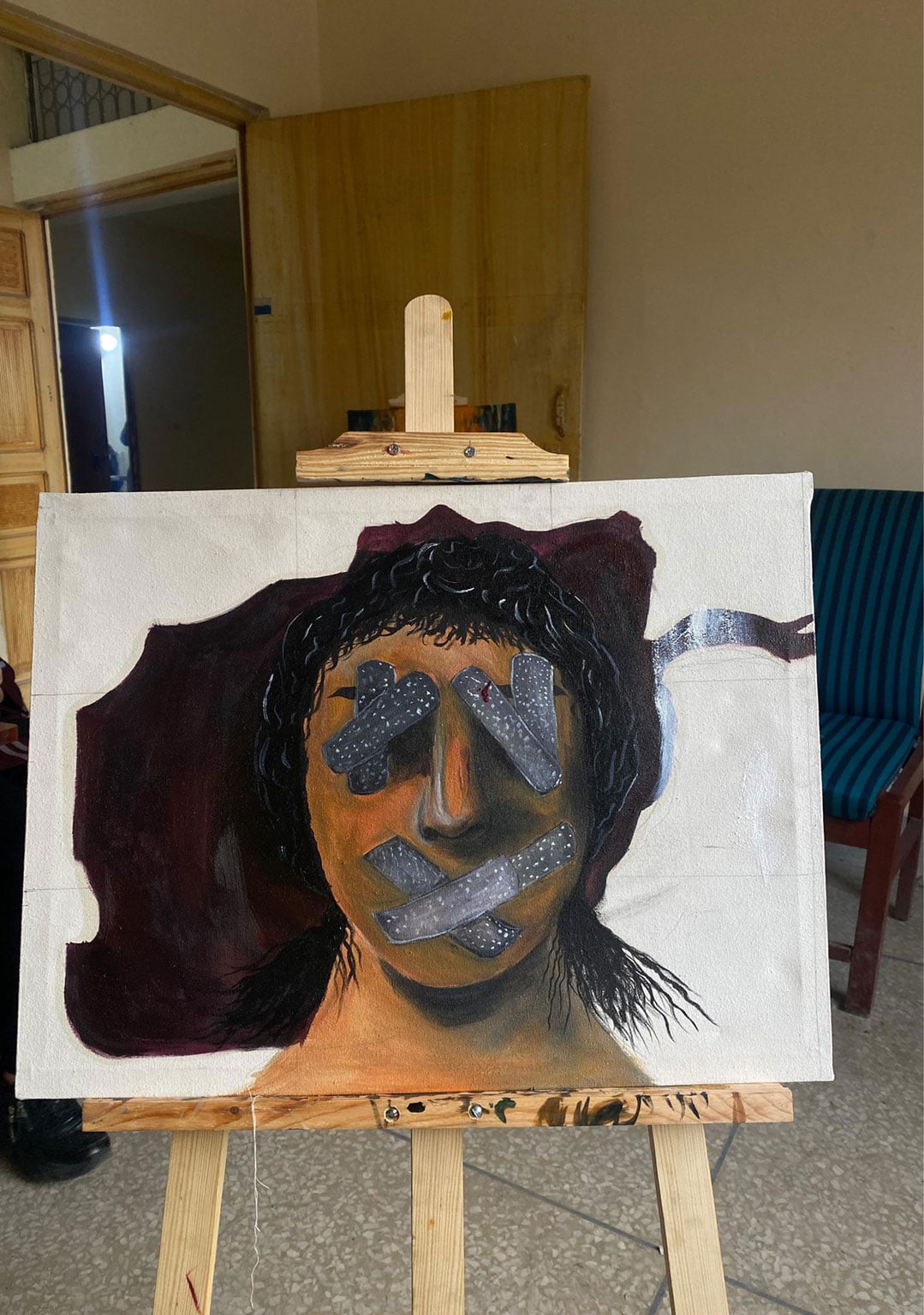 Artist's painting shows silenced woman, symbolizing Taliban restrictions on women. (Photo Credit: Exclusive)