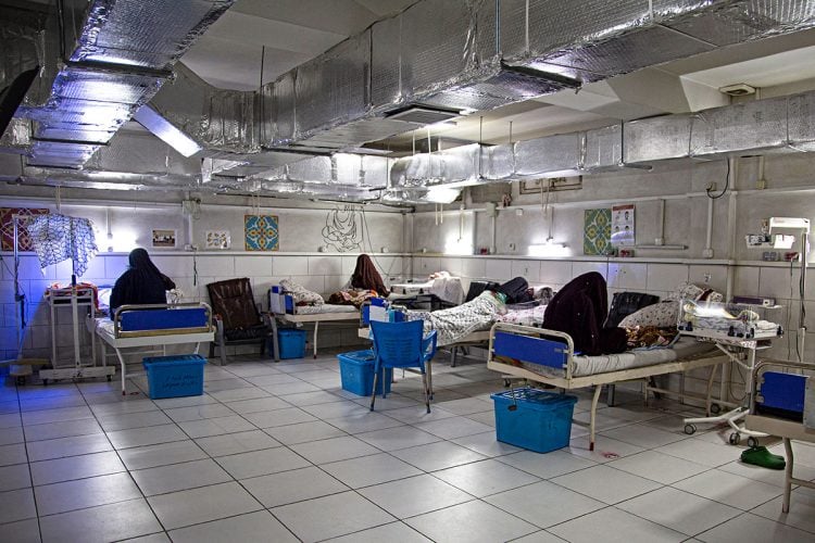 Patients receive treatment in a crowded ward at a Kabul hospital, highlighting the strained healthcare conditions in Afghanistan. (Photo Credit: AFP)