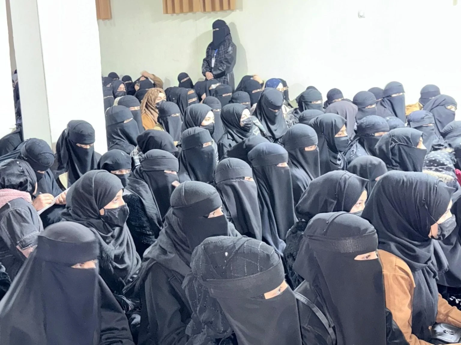 omen and girls in burqas gather in a Taliban-controlled madrasa in Kabul, reflecting strict dress codes. (Photo Credit: Social Media)