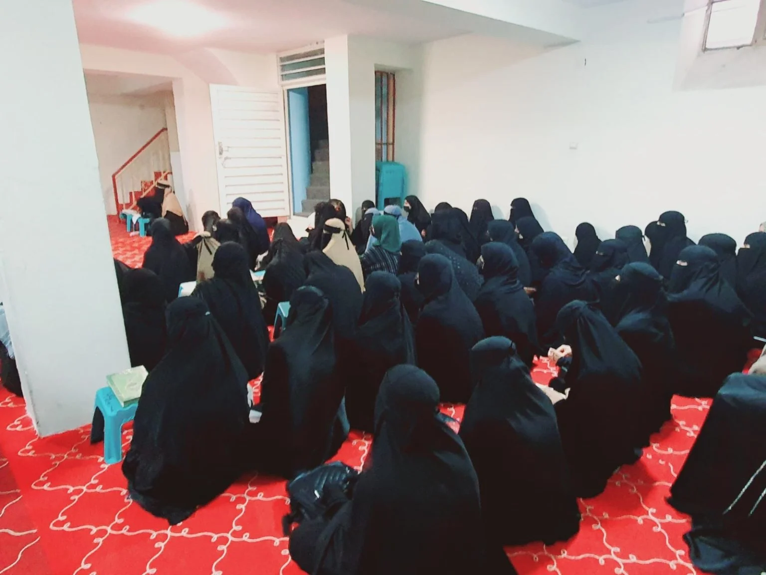 Women and girls in burqas attend a session in a Taliban-controlled madrasa. (Photo Credit: Social Media)