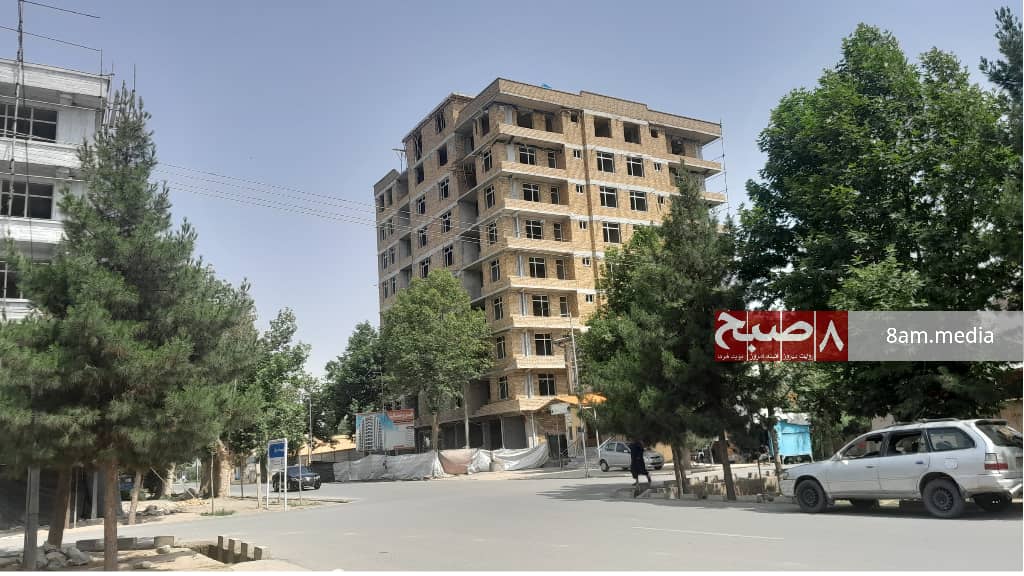 A multi-story building under construction in Taloqan reflects the ongoing development amidst regulatory challenges. (Photo Credit: 8am.media)