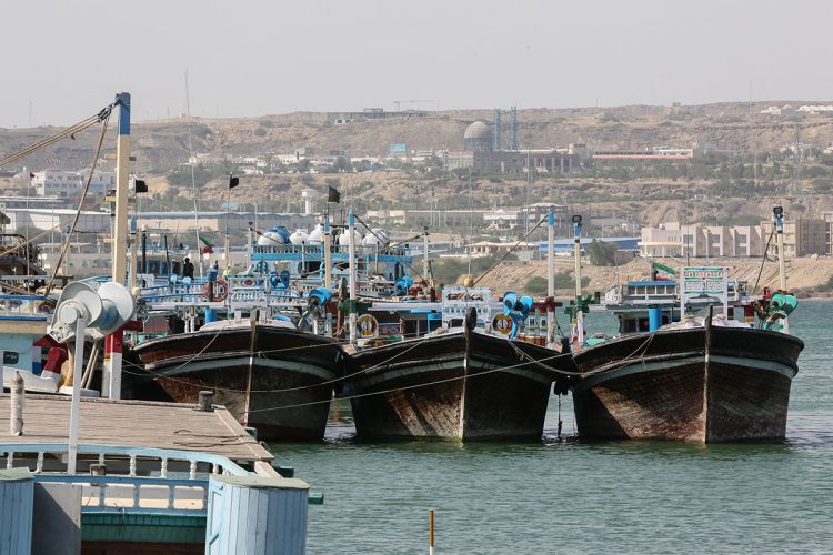 Fishing boats docked at a bustling port in southeastern Iran, showcasing the maritime activity at Chabahar Port. (Photo Credit: AFP)