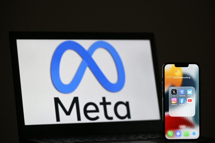 Meta logo on a laptop with social media apps on a smartphone. (Photo Credit: AFP)