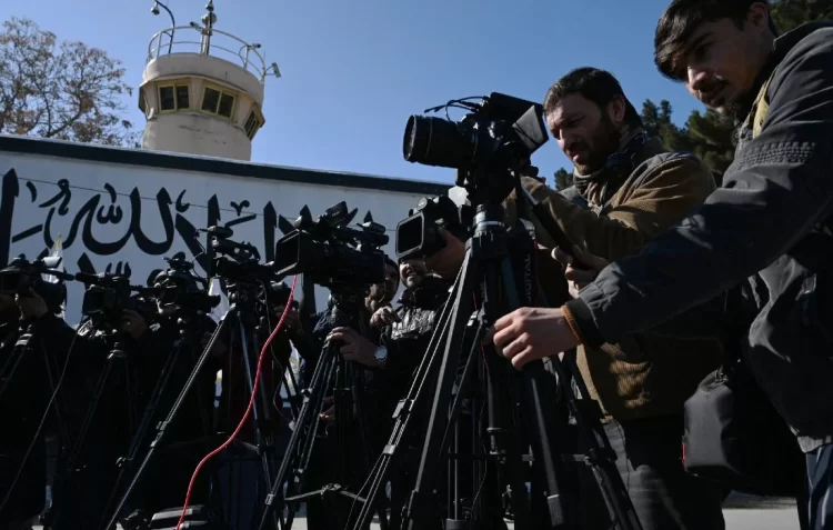Journalists set up cameras outside a government building, capturing a significant event under clear skies. (Photo Credit: iras.ir)
