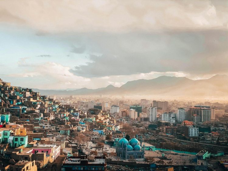 A panoramic view of Kabul, showcasing its vibrant neighborhoods and iconic mosque against a backdrop of mountains, amid reports of heightened Taliban surveillance. (Photo Credit: Pexels)