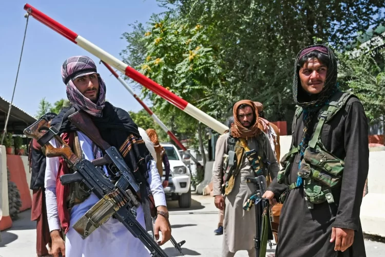 Taliban fighters stand guard at a checkpoint in Kabul following their seizure of power in Afghanistan. (Photo Credit: NBC)