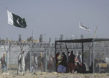 People gather near the fenced border area between Pakistan and Afghanistan following a deadly suicide bombing in Chaman that killed at least six people and forced the closure of the Spin Boldak crossing. (Photo Credit: Social Media)