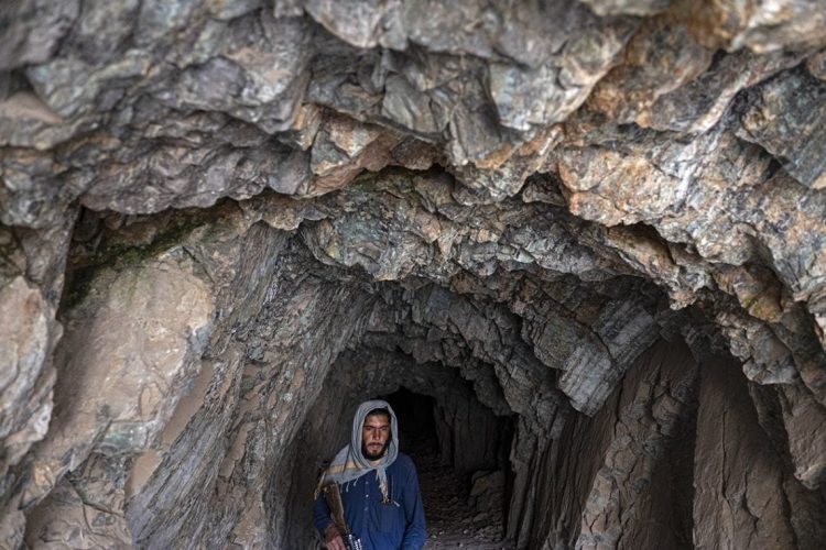 A miner works inside a tunnel at a mining site in Afghanistan. The Taliban's Ministry of Mines and Petroleum has signed over 205 mining contracts since 2021, many lacking proper environmental assessments. (Photo Credit: AP)