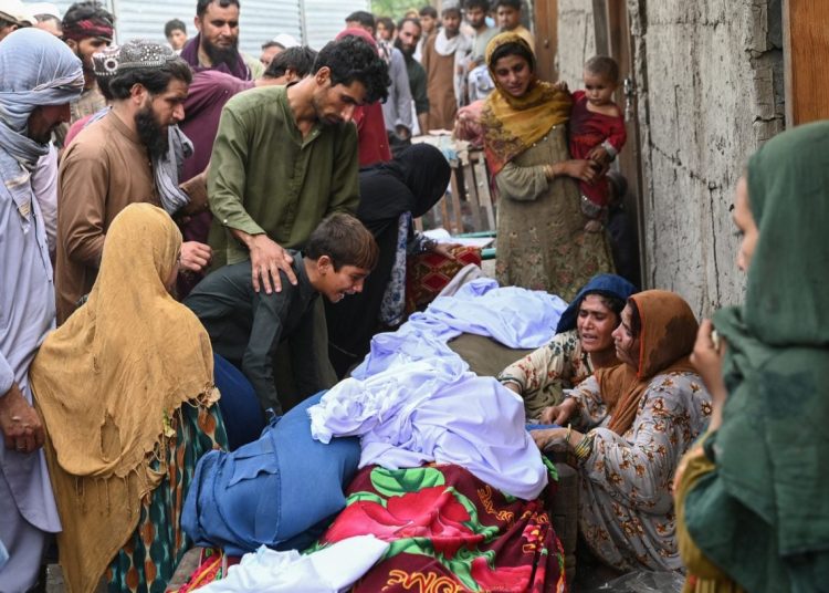 Grieving families mourn victims of the deadly Kunar earthquake as rescue operations continue in the affected areas of Afghanistan, September 4, 2025. (Photo Credit: Wakil Kohsar / AFP)