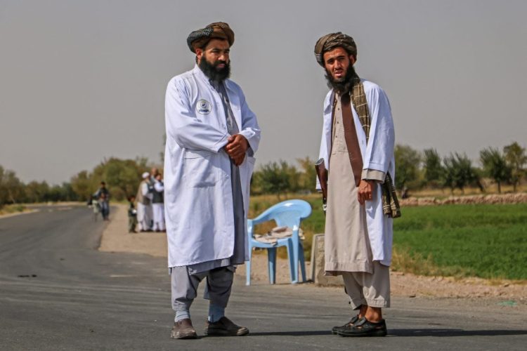 Caption: Taliban officials in Afghanistan amid reports of a girl's arrest in Herat for teaching mathematics, highlighting education restrictions on women. (Photo Credit: Mohsen KARIMI / AFP)