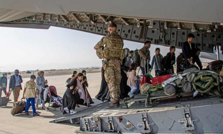 Afghan evacuees board a Royal Air Force aircraft during the UK's evacuation operation from Kabul in 2021, part of the resettlement program now affected by multiple data breach incidents. (Photo Credit: PA)