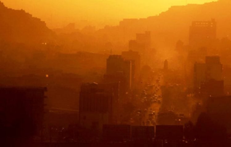 Thick smog blankets an Afghanistan city as air pollution reaches critical levels, endangering public health amid increased use of coal and plastic for heating during winter months. (Photo Credit: UN-Habitat)