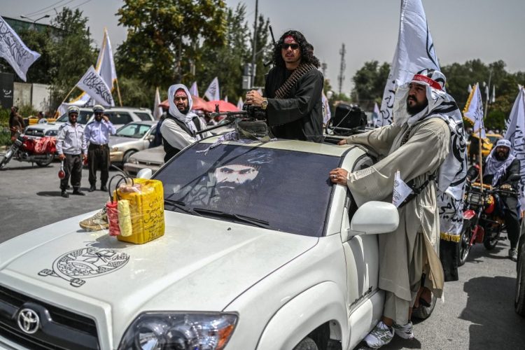 Taliban fighters patrol Kabul amid a nationwide internet and telecommunications blackout that has left ordinary citizens cut off while only international organizations maintain connectivity through VSAT. (Photo Credit: Wakil KOHSAR / AFP)
