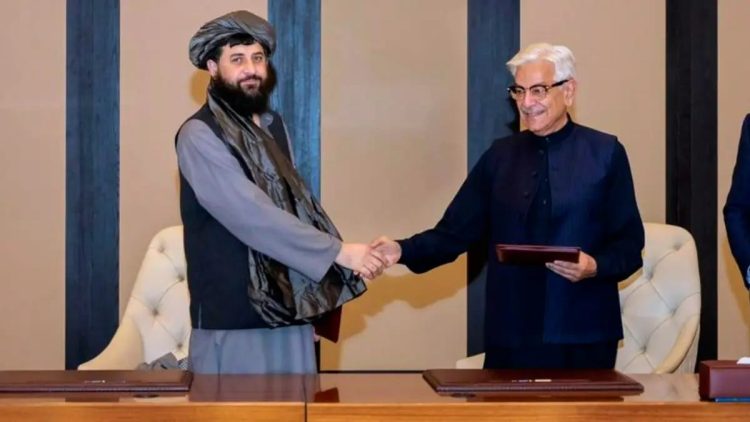 Senior Taliban official and Pakistani defense minister shake hands during Istanbul peace negotiations. (Photo Credit: MOFAQatar/x)
