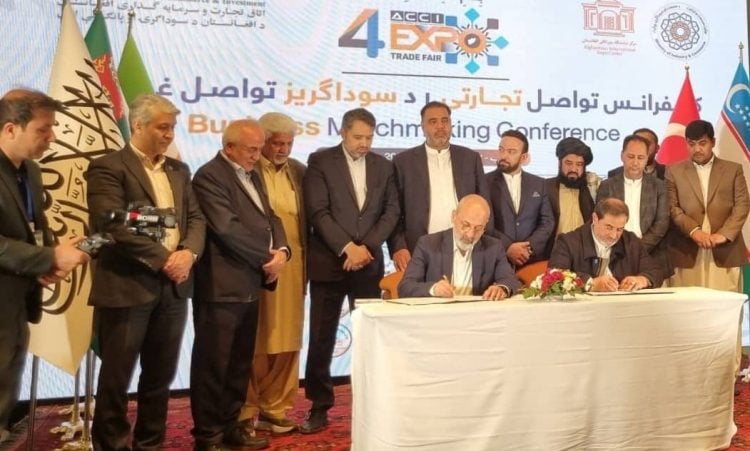 Iranian and Taliban officials witness the signing of a cooperation agreement between their chambers of commerce at a business matchmaking conference in Kabul. (Photo Credit: @IRANinKabul)