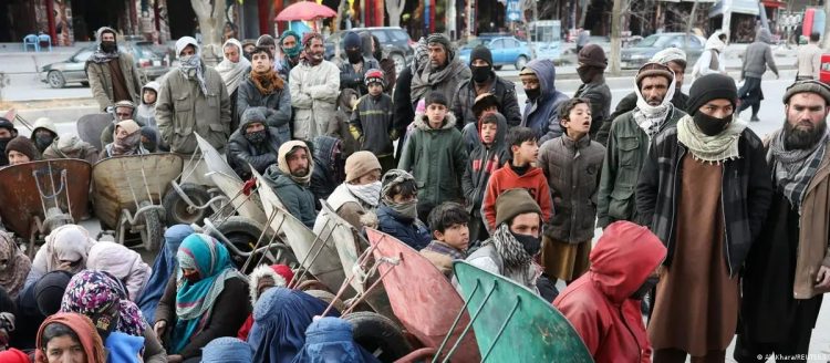 Afghans gather in Kabul seeking work opportunities amid severe unemployment and economic crisis that has left thousands struggling to meet basic needs. (Photo Credit: Ali Khara/Reuters)