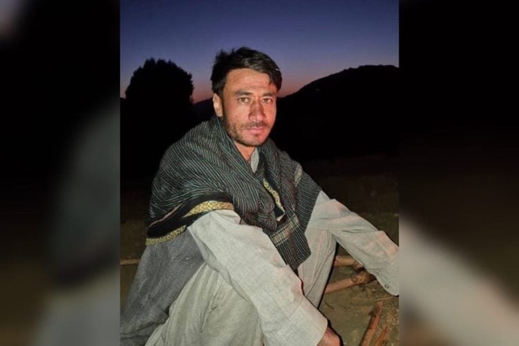 A man sitting outdoors at dusk in traditional clothing in Maidan Wardak province, Afghanistan. (Photo Credit: Exclusive)