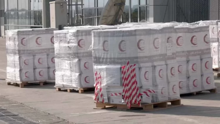 Pallets of humanitarian aid boxes marked with red crescent symbols are prepared for shipment to earthquake-affected areas in northern Afghanistan as part of the UAE's relief efforts. (Photo Credit: Sharjah)