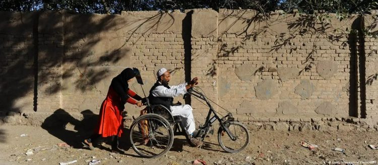 A man with a disability navigates mobility challenges in Afghanistan, highlighting the infrastructure barriers faced by persons with disabilities in accessing basic services and participating in daily life. (Photo Credit: Getty Images/Reza Deghati)