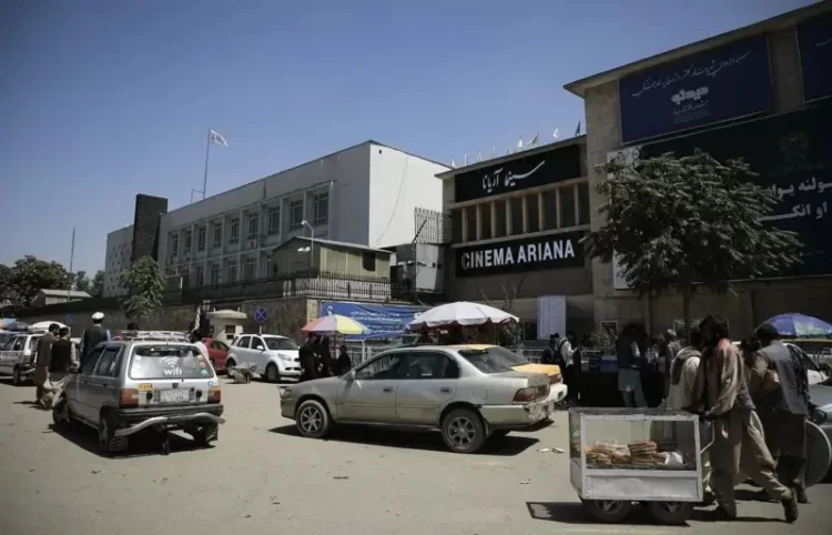 Street scene outside the historic Ariana Cinema in Kabul, Afghanistan, showing the beloved cultural venue that welcomed generations of film enthusiasts before its recent demolition by the Taliban to make way for a commercial complex. (Photo Credit: Getty Images)