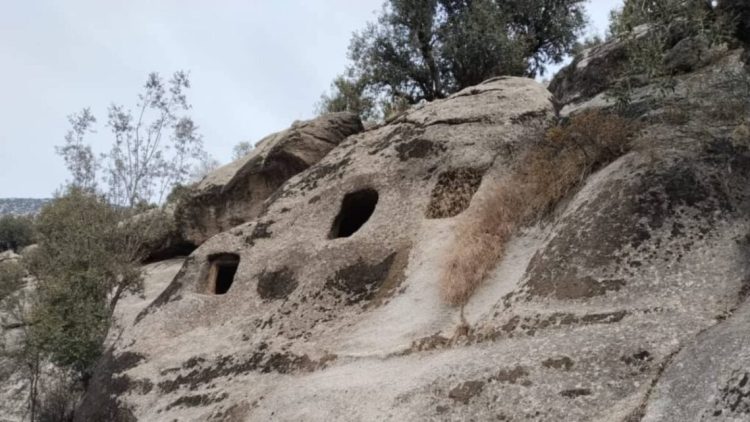 Ancient rock-cut chambers discovered in Laghman Province's Saw Valley, dating back over 2,500 years to Afghanistan's Iron Age period. (Photo Credit: Arkeonews)