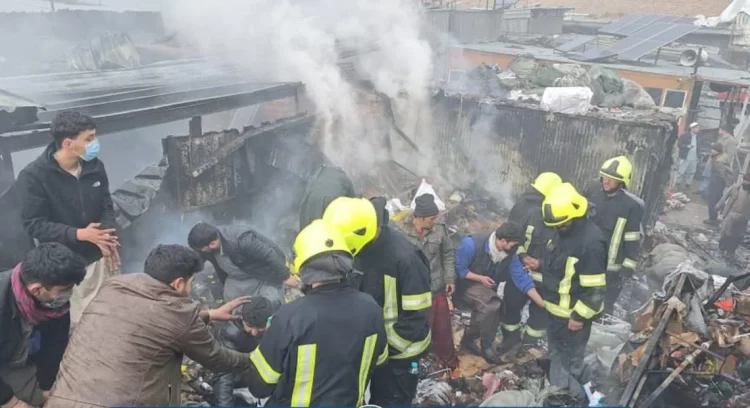 Firefighters and civilians search through the debris after a massive blaze tore through Kabul’s Mandawi market, leaving shops destroyed and livelihoods lost. (Photo Credit: Social Media)