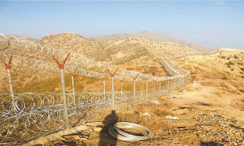 Barbed-wire fencing stretches across arid hills along Pakistan's border with Afghanistan, part of the nearly complete security barrier covering thousands of kilometers of the Durand Line. (Photo Credit: Dawn)