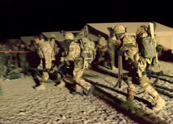 British Special Forces soldiers on a nighttime operation in Afghanistan. The image shows personnel in full combat gear moving across terrain during operations between 2010 and 2013, a period now under investigation for alleged unlawful killings. (Photo Credit: DECLASSIFIED UK)