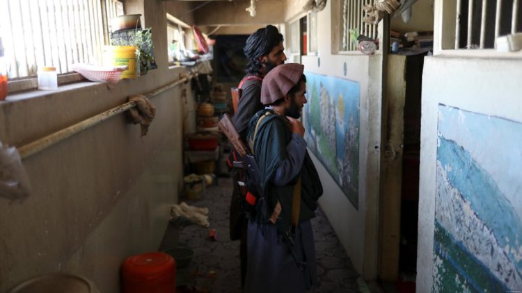 Taliban fighters stand inside a building amid growing internal criticism over arrests and abuse by the group’s intelligence services. (Photo Credit: Reuters)