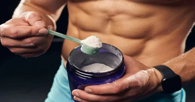 A young bodybuilder measures protein powder for supplementation, illustrating the growing trend of artificial protein use among youth that doctors warn carries serious health risks including kidney damage, liver problems, and digestive issues. (Photo Credit: Sarzamin Mokamel)