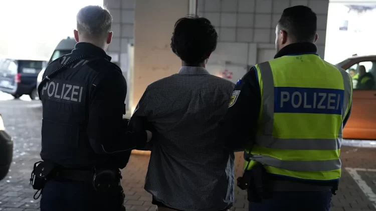 German police escort an Afghan asylum seeker during deportation proceedings as authorities continue implementing strict return policies for individuals deemed criminals. (Photo Credit: BILD)