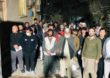 More than 250 Afghan migrants who were detained in Pakistani prisons pose for a group photo after their release and return to Afghanistan via the Spin Boldak border crossing. (Photo Credit: @MoRRAfg)