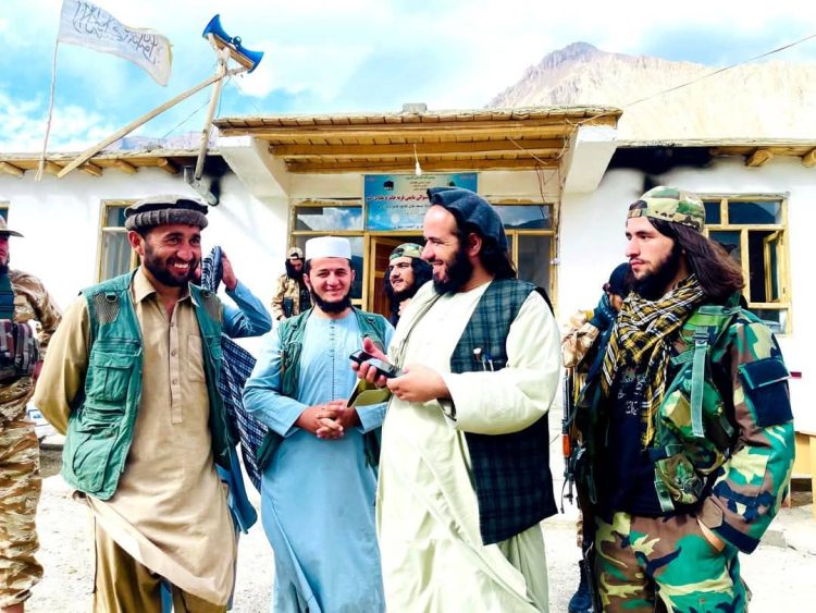 Taliban members stand outside a public building in Badakhshan amid reports of growing pressure and repression against the Ismaili community. (Photo Credit: Social Media)