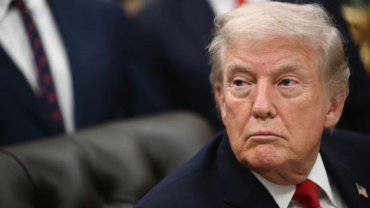 U.S. President Donald Trump at a meeting following warnings from UN Secretary-General António Guterres about severe budget cuts threatening the organization's financial stability. (Photo Credit: AFP via Getty Images)