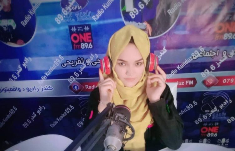 Female journalist Nazera Rashidi at her radio station workplace in Kunduz province, Afghanistan, before being detained and tortured by the Taliban. (Photo Credit: Exclusive)