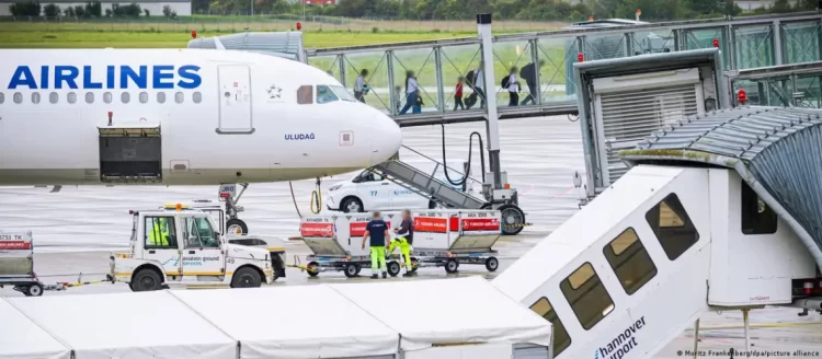 Asylum seekers board a deportation flight at Hannover Airport, as Germany steps up its efforts to remove convicted criminals from the country. (Photo Credit: Moritz Frankenberg/dpa/picture alliance)