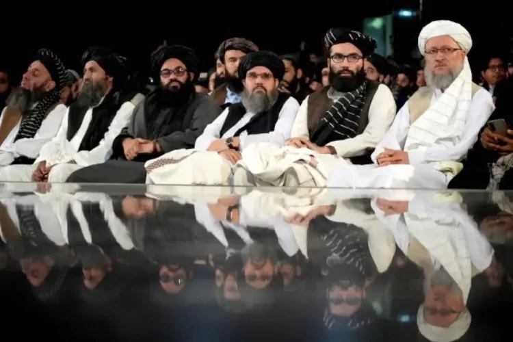 Taliban leaders attend a meeting in Afghanistan. The UN Security Council has extended sanctions monitoring against the group for another year. (Photo Credit: AP)